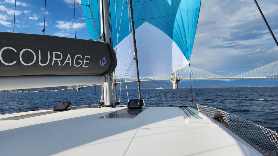 Bow view showing the Courage name and headsail