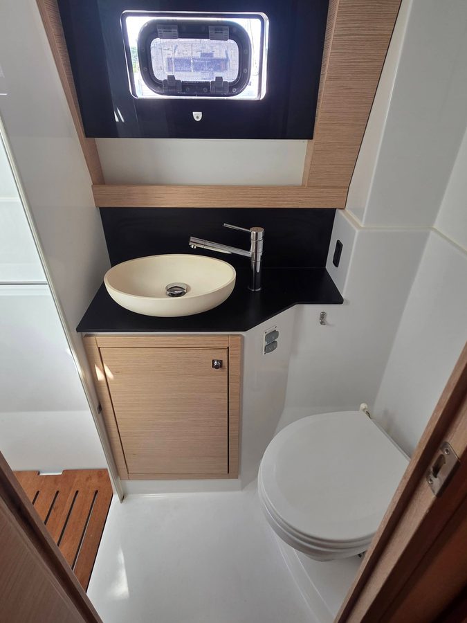 Starboard head vanity, sink, and toilet