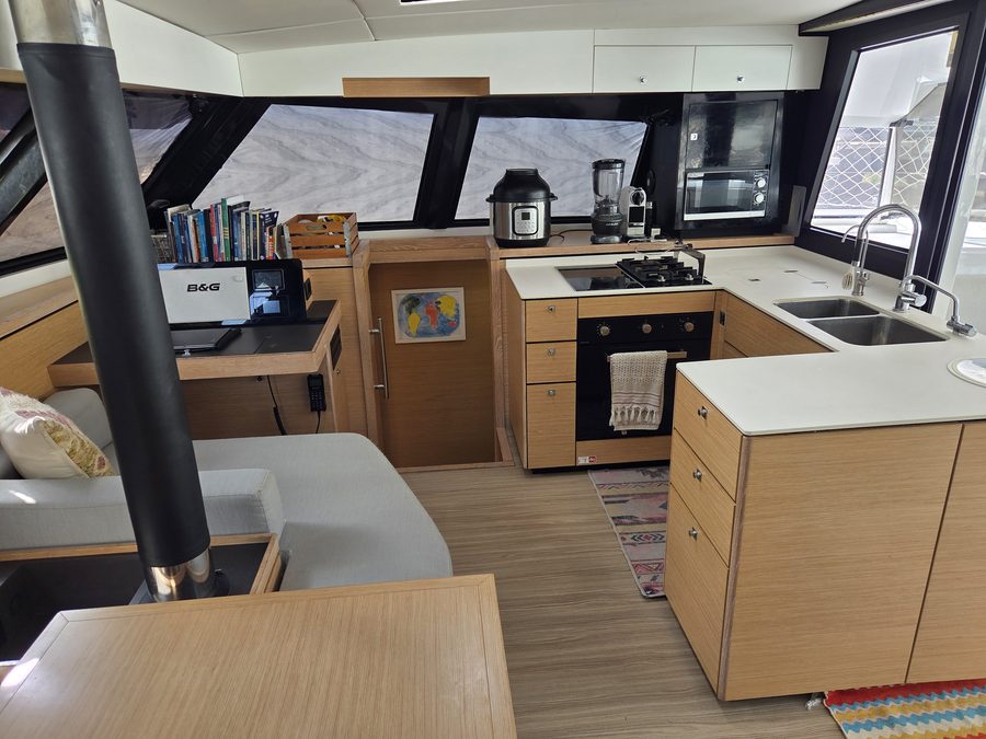 Galley with oven and cooktop, nav station alongside