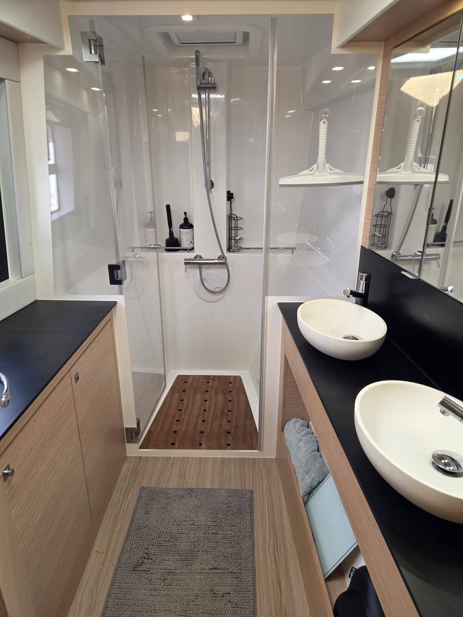 Master head with twin vessel sinks and walk-in shower