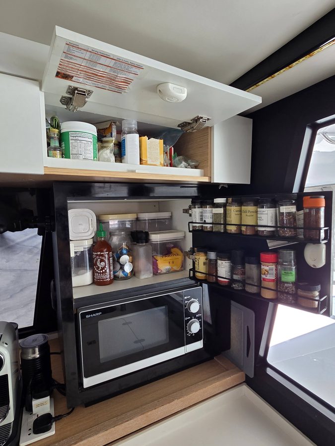 Galley pantry locker with microwave and spice racks